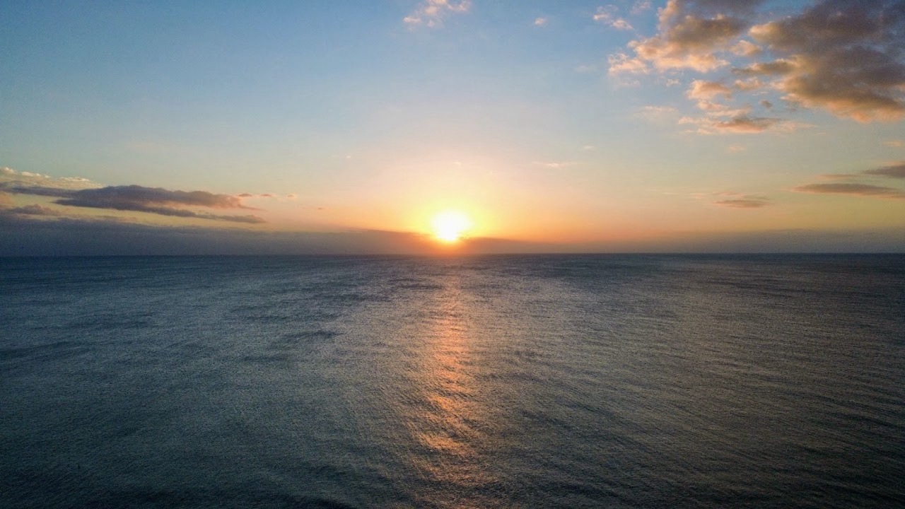 Sunset over open water