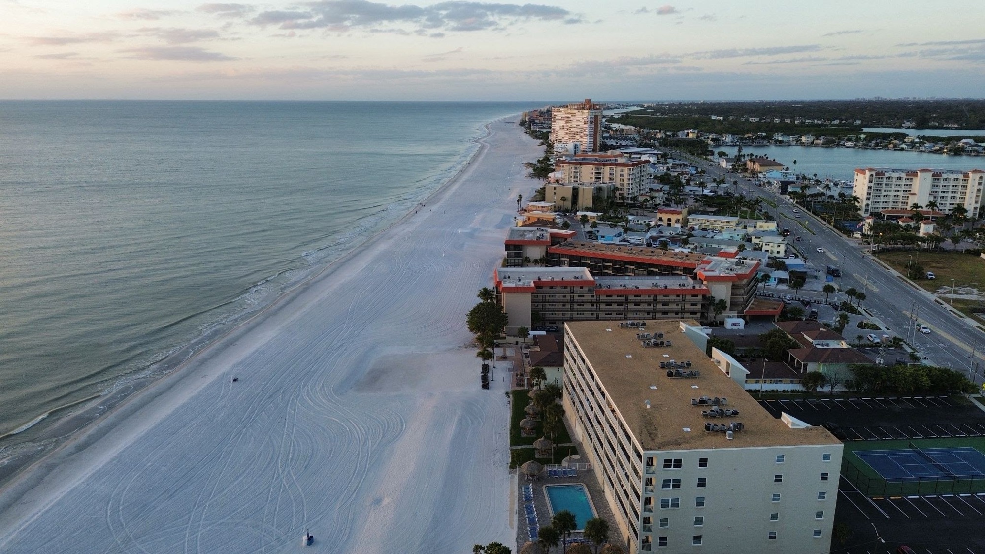 Beachfront hotels along white sand