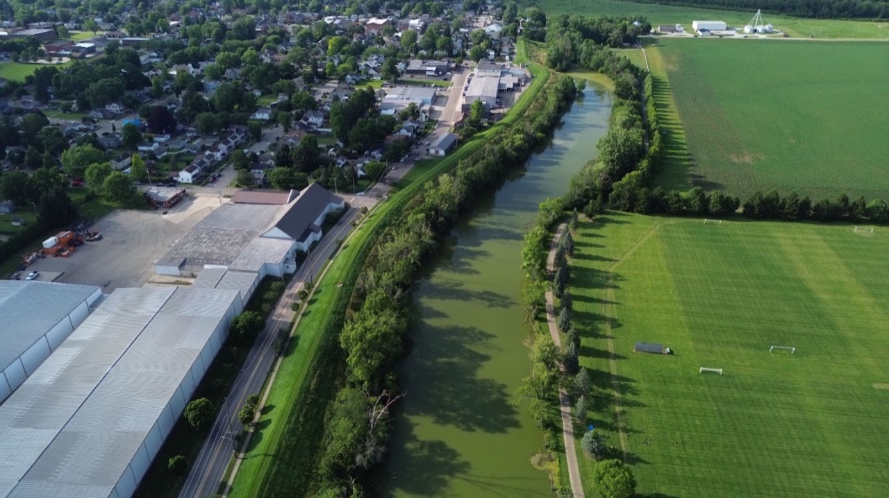 Neighborhood beside a canal and sports fields